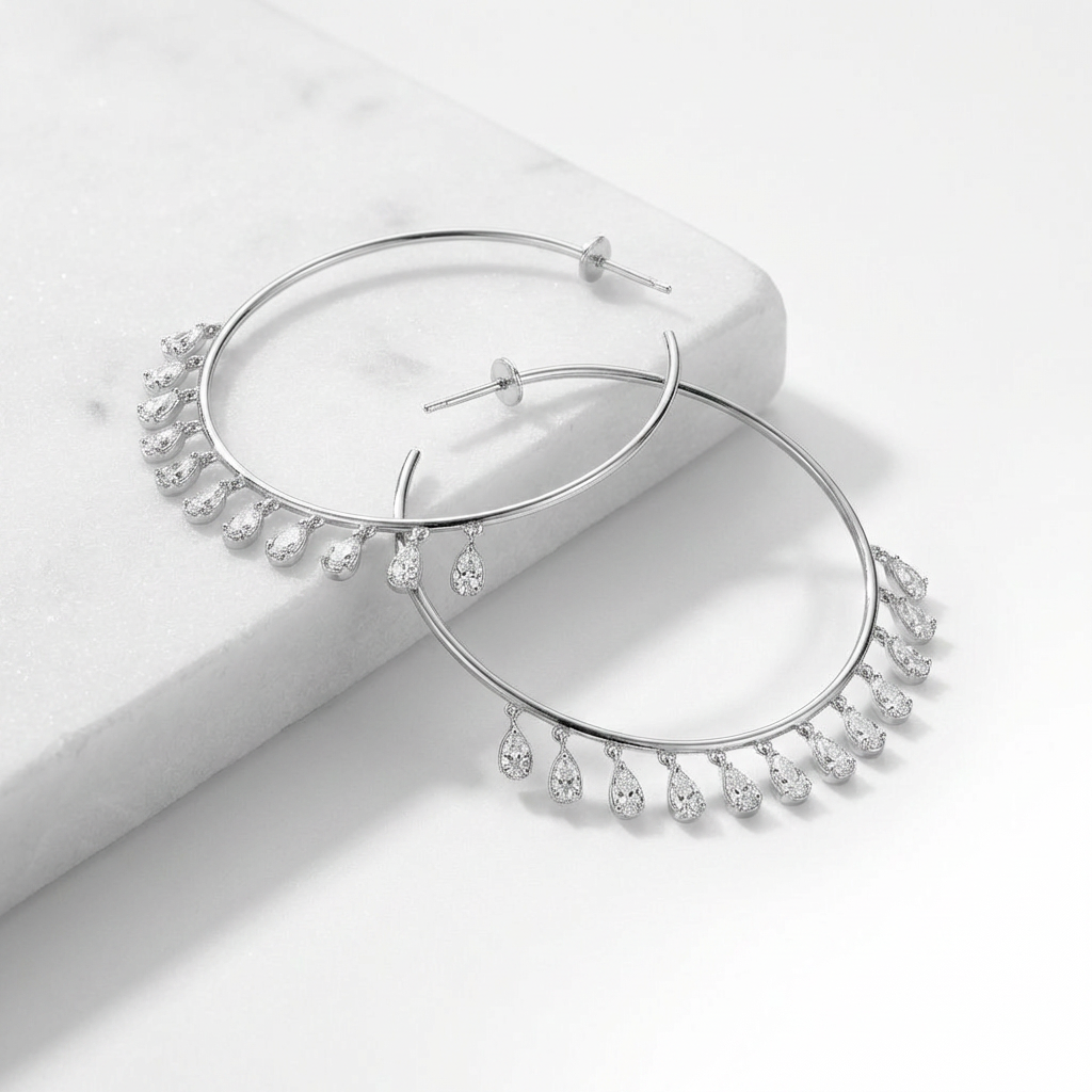 Inès Silver hoops — delicate 47mm circle with grade 5A zirconia drop charms in rhodium plated 925 silver. Ultra lightweight, hypoallergenic, water-resistant.