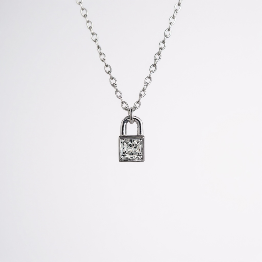 Yours Silver necklace — mirror padlock & diamond zirconia in rhodium plated 925 silver. 40+5cm, waterproof, hypoallergenic. Understated, elegant, full of meaning.